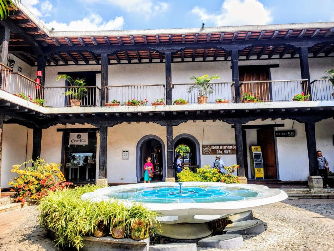 Courtyard of a colonial building with a central fountain in Antigua, reflecting the local lifestyle for an Antigua, Guatemala itinerary.