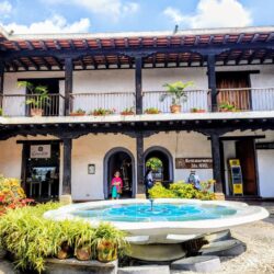 Courtyard of a colonial building with a central fountain in Antigua, reflecting the local lifestyle for an Antigua, Guatemala itinerary.