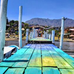 Colorful painted dock leading to Lake Atitlan, inviting exploration and relaxation as one of the best things to do in Panajachel.